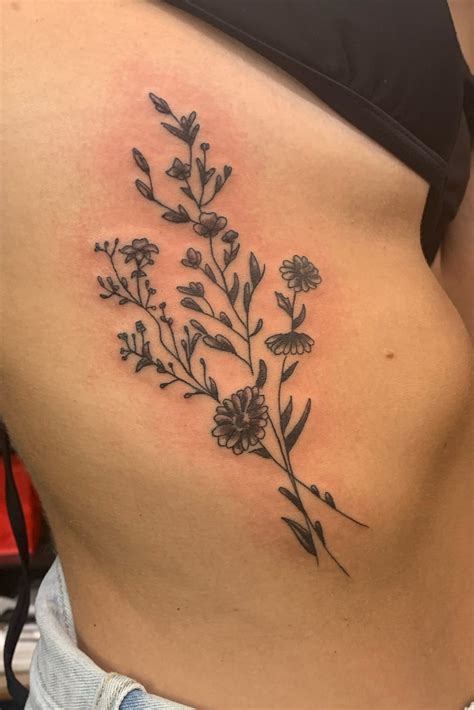 flowers on side tattoo